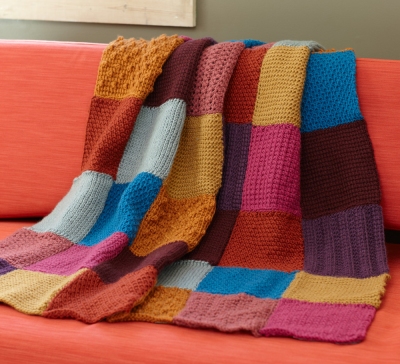 Multi-coloured blanket in crochet squares